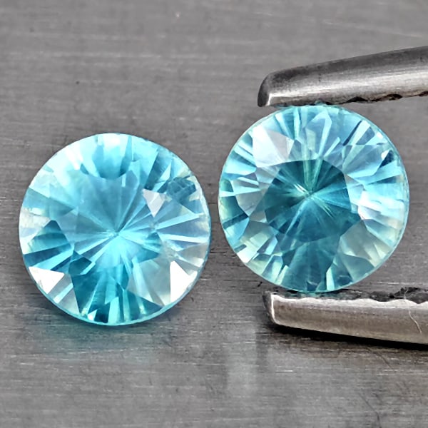 Natural Blue Zircon Gemstones 0.96 Ct. 2 Pcs. Round Diamond Cut 4.6 Mm.: Product ID: 807743278 Product Name: Natural Gemstones Weight: 0.96 CT. Size: 4.6 x 4.6 x 3 MM. Shape: Round Diamond Cut Color: Blue Clarity:SI1 Luster: Good Gems Origin: Cambodia Treatment: Heated Cry