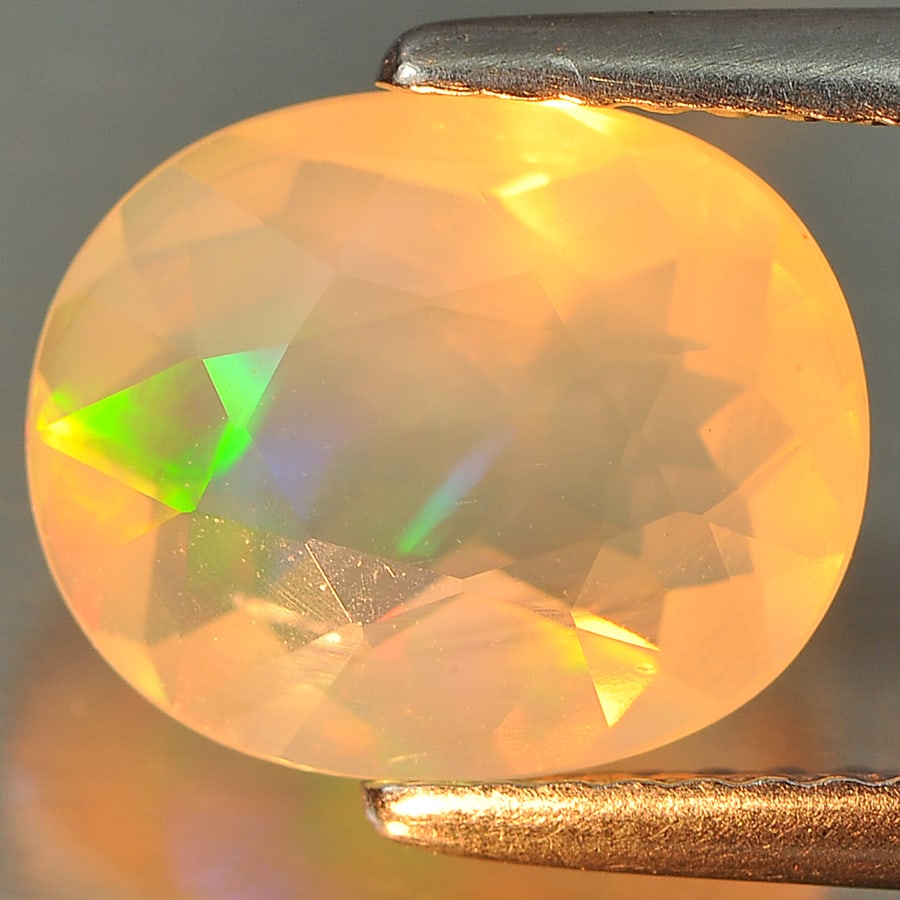 Natural Multi Color Opal Gemstones 1.97 Ct. Oval 10.4 x 8.5 Mm. (1 of 3)