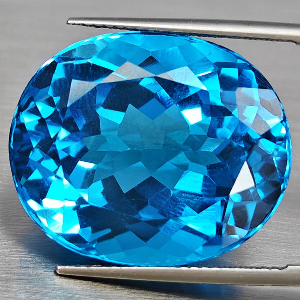 Natural Swiss Blue Topaz Gemstone s42.41 Ct. Oval Shape 22 x 19 Mm.: Product ID: 807168691 Product Name: Natural Blue Topaz Weight: 42.41 CT. Size: 22 x 19 x 12.5 MM. Shape: Oval Color: Swiss Blue Clarity:VVS Luster: Good Gems Origin: Brazil Treatment: Treated Crystal 