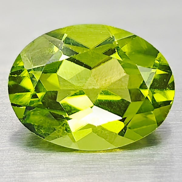 Natural Green Peridot Gemstone1.75 Ct. Oval Shape 7 x 9 Mm.: Product ID: 805316928 Product Name: Natural Peridot Weight: 1.75 CT. Size: 7 x 9 x 3.9 MM. Shape: Oval Color: Green Clarity:VSI Luster: Good Gems Origin: Pakistan Treatment: Unheated Crystal Structure