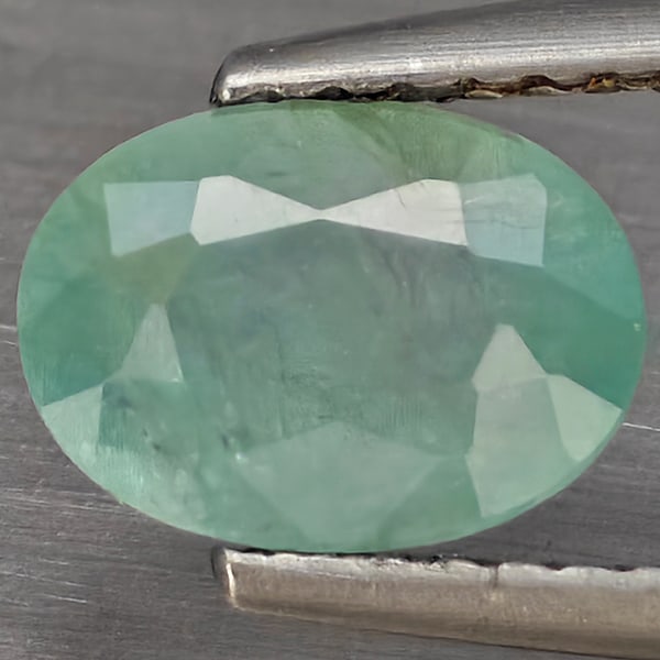 Natural Green Blueish Grandidierite Gemstones 1.39 Ct. Oval Shape 8 x 5.9 Mm.: Product ID: 803100123 Product Name: Natural Tsavorite Weight: 1.39 CT. Size: 8 x 5.9 x 4.4 MM. Shape: Oval Shape Color: Green Blueish Clarity:SI1 Luster: Good Gems Origin: Madagascar Treatment: Unheat