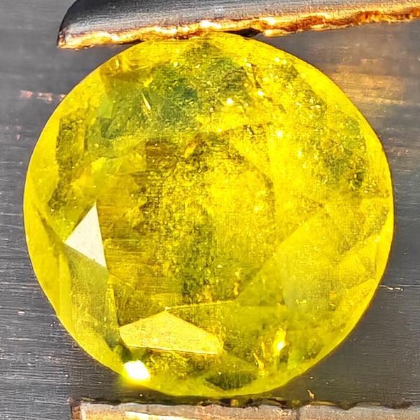 Natural Multi-Color With Rainbow Spark Sphene Gemstones 0.82 Ct. Round Shape 5.9 Mm.: Product ID: 806509255 Product Name: Natural Sphene Weight: 0.82 CT. Size: 5.9 x 5.9 x 3.6 MM. Shape: Round Shape Color: Multi-Color Clarity:SI1 Luster: Good Gems Origin: Madagascar Treatment: Unheated