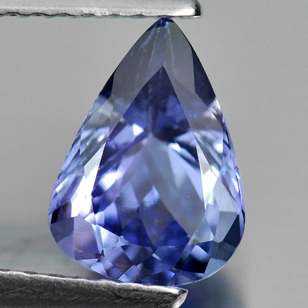 Natural Blue Tanzanite Gemstones 1.45 Ct. VVS Peas Shape 9 x 6.6 Mm.: Product ID: 807009308 Product Name: Natural Tanzanite Weight: 1.45 CT. Size: 9 x 6.6 x 4.5 MM. Shape: Pear Color: Violetish Blue Clarity:VVS Luster: Good Gems Origin: Tanzania Treatment: Heated Crysta