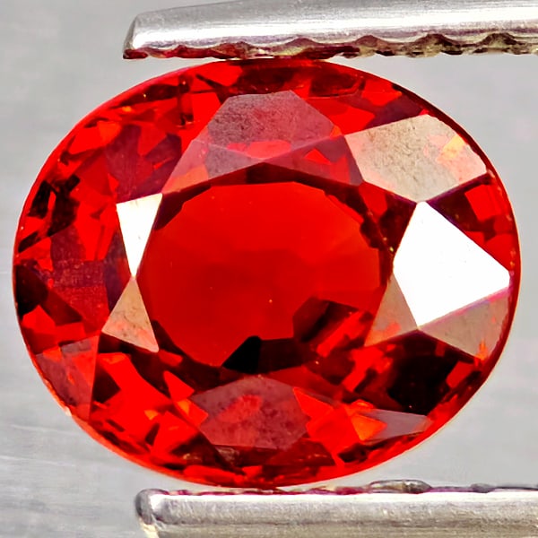 Natural Orangish Red Spessartine Garnet Gemstones 1.22 Ct. Oval Shape 6.6 x 5.6 Mm.: Product ID: 802937197 Product Name: Natural Spessartine Weight: 1.22 CT. Size: 6.6 x 5.6 x 3.5 MM. Shape: Oval Color: Orangish Red Clarity:VSI Luster: Good Gems Origin: Namibia Treatment: Unheated Cry