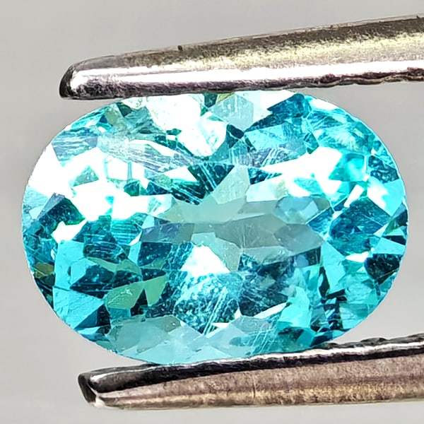Natural Paraiba Color Apatite Gemstones 0.72 Ct. Oval Shape 6.7 x 4.8 Mm.: Product ID: 800613690 Product Name: Natural Apatite Weight: 0.72 CT. Size: 6.7 x 4.8 x 3.4 MM. Shape: Oval Color: Neon Blue Clarity:VSI Luster: Good Gems Origin: Tanzania Treatment: Unheated Crystal S