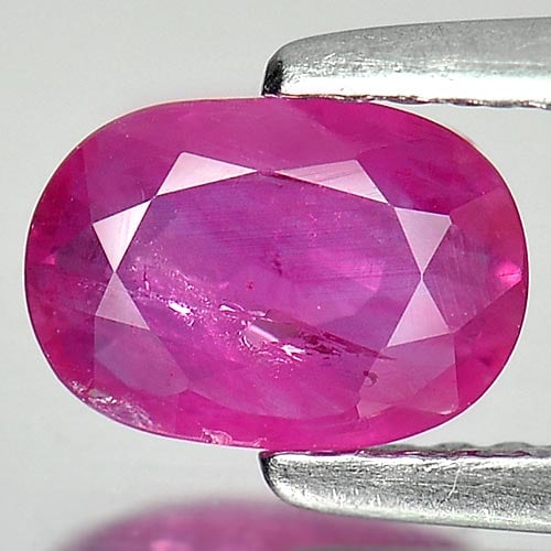 Natural Purplish Pink Ruby Gemstones 1.04 Ct. Oval Shape 7.2 x 5.1 Mm.: Product ID: 805923491 Product Name: Natural Ruby Weight: 1.04 CT. Size: 7.2 x 5.1 x 2.6 MM. Shape: Oval Color: Purplish Pink Clarity:VSI Luster: Good Gems Origin: Thailand Treatment: Heated Crystal St