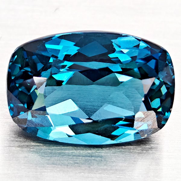 Natural London Blue Topaz Gemstones 4.96 Ct. Cushion Shape 11.6 x 8.1 Mm.: Product ID: 807168323 Product Name: Natural Blue Topaz Weight: 4.96 CT. Size: 11.6 x 8.1 x 6.3 MM. Shape: Cushion Shape Color: London Blue Clarity:VVS - VSI Luster: Good Gems Origin: Brazil Treatment: