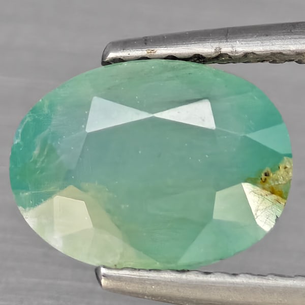 Natural Green Blueish Grandidierite Gemstones 2.16 Ct. Oval Shape 9.2 x 7 Mm.: Product ID: 803100042 Product Name: Natural Tsavorite Weight: 2.48 CT. Size: 9.2 x 7 x 4.5 MM. Shape: Oval Shape Color: Green Blueish Clarity:SI1 Luster: Good Gems Origin: Madagascar Treatment: Unheat