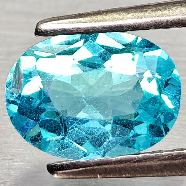 Natural Paraiba Color Apatite Gemstones 0.78 Ct. Oval Shape 7.1 x 5.2 Mm.: Product ID: 800613686 Product Name: Natural Apatite Weight: 0.78 CT. Size: 7.1 x 5.2 x 3.2 MM. Shape: Oval Color: Neon Blue Clarity:VSI Luster: Good Gems Origin: Tanzania Treatment: Unheated Crystal S
