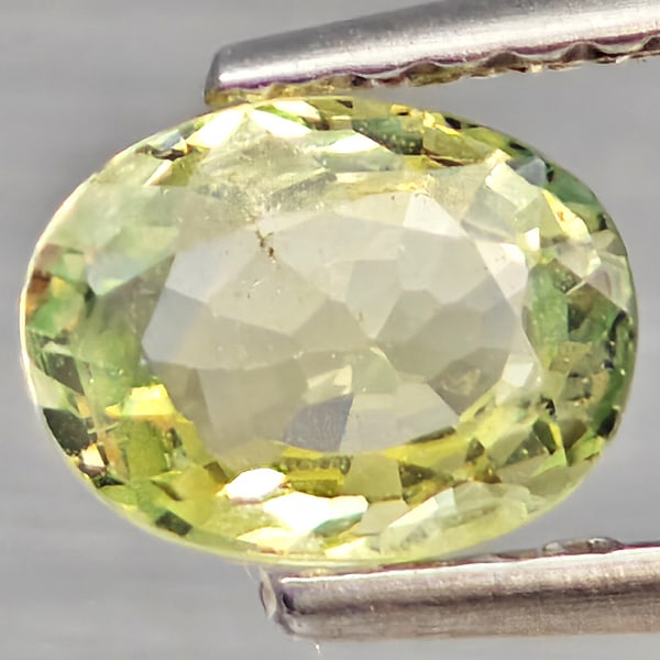 Natural Green Sapphire Gemstones 0.93 Ct. Oval Shape 6.6 x 5 Mm.: Product ID: 806162750 Product Name: Natural Green Sapphire Weight: 0.93 CT. Size: 6.6 x 5 x 3.1 MM. Shape: Oval Shape Color: Green Clarity:VSI Luster: Good Gems Origin: Thailand Treatment: Heated Crys