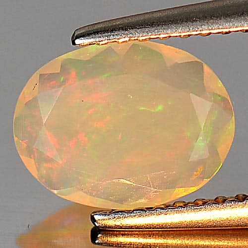 Natural Multi Color Play Of Colour Opal Gemstones 0.71 Ct. Oval Shape 9.1 x 7.1 Mm.: Product ID: 818726196 Product Name: Natural Opal Weight: 0.71 CT. Size: 9.1 x 7.1 x 2.9 MM. Shape: Oval Color: Multi Color Clarity:Semi - Transparent Luster: Iridescent Gems Origin: Ethiopia Treatment