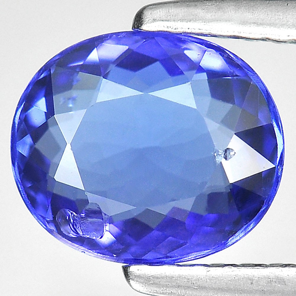 Natural Blue Tanzanite Gemstones 1.43 Ct. Oval Shape 7.9 x 6.7 Mm.: Product ID: 807006129 Product Name: Natural Tanzanite Weight: 1.43 CT. Size: 7.9 x 6.7 x 3.3 MM. Shape: Oval Color: Blue Clarity:SI1 Luster: Good Gems Origin: Tanzania Treatment: Heated Crystal Struct