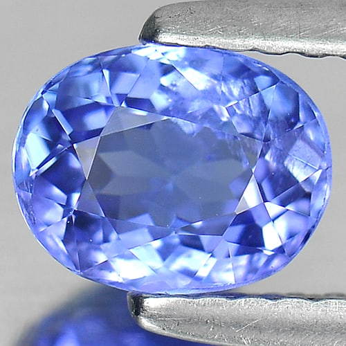 Natural Blue Tanzanite Gemstones 0.99 Ct. Clean Oval Shape 6.6 x 5.2 Mm.: Product ID: 807005354 Product Name: Natural Tanzanite Weight: 0.99 CT. Size: 6.6 x 5.2 x 3.9 MM. Shape: Oval Color: Purple Clarity:SI Luster: Good Gems Origin: Tanzania Treatment: Heated Crystal Struc