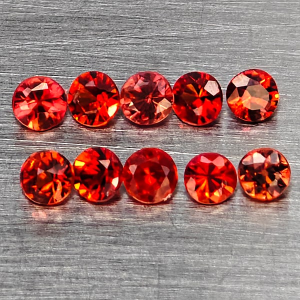 Natural Orangish Red Songea Sapphire Gemstones 0.61 Ct. 10 Pcs Round Diamond Cut 2 Mm.: Product ID: 806162822 Product Name: Natural Red Sapphire Weight: 0.61 CT. Size: 2 x 2 x 1.6 MM. Shape: Round Diamond Cut Color: Orangish Red Clarity:SI1 Luster: Good Gems Origin: Tanzania Treatment: H