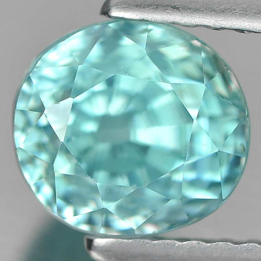 Natural Blue Zircon Gemstones 3.16 Ct. Oval Shape 7.4 x 6.8 Mm.: Product ID: 807727794 Product Name: Natural Zircon Weight: 3.16 CT. Size: 7.4 x 6.8 x 6.2 MM. Shape: Oval Color: Blue Clarity:VSI Luster: Very Good Gems Origin: Cambodia Treatment: Heated Crystal Stru