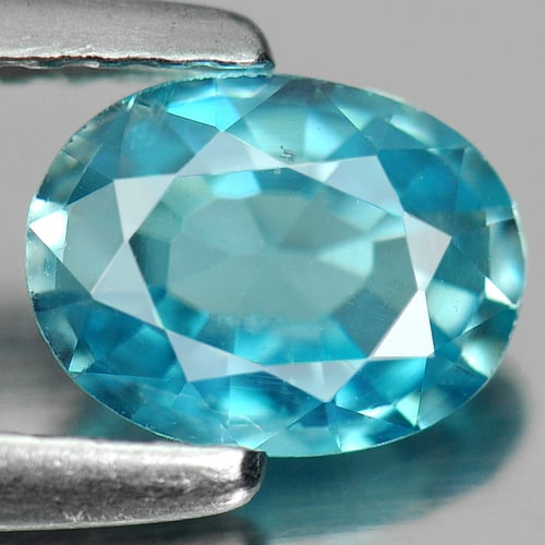 Natural Blue Zircon Gemstone 0.96 Ct. Oval Shape 6.8 x 5.2 Mm.: Product ID: 807711201 Product Name: Natural Zircon Weight: 0.96 CT. Size: 6.8 x 5.2 x 2.6 MM. Shape: Oval Color: Blue Clarity:SI Luster: Good Gems Origin: Cambodia Treatment: Heated Crystal Structure: