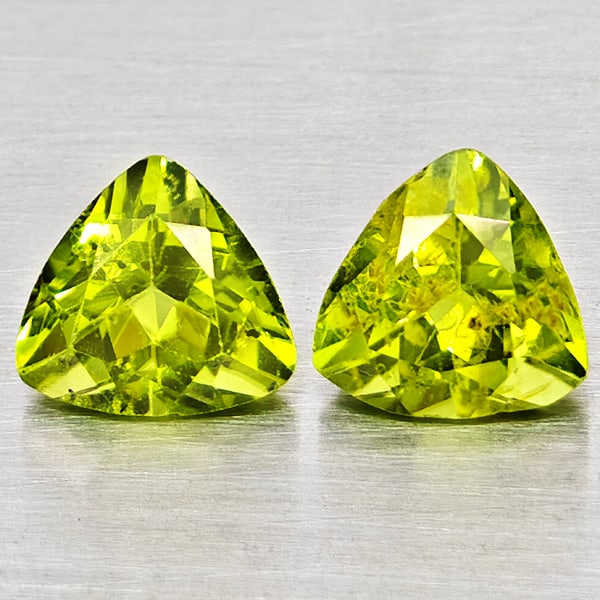 Natural Green Peridot Gemstones 1.83 Ct. 2 Pcs Trilliant Shape 6 Mm.: Product ID: 805317547 Product Name: Natural Peridot Weight: 1.83 CT. Size: 6 x 6 x 4.2 MM. Shape: Trilliant Color: Green Clarity:SI1 Luster: Good Gems Origin: Pakistan Treatment: Unheated Crystal Stru