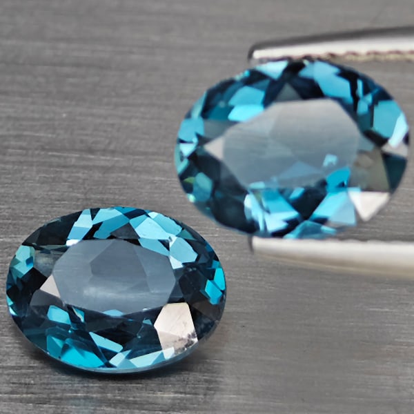 Natural London Blue Topaz Gemstones 3.60 Ct. 2 Pcs Oval Shape 9.3 x 7.4 Mm.: Product ID: 807168931 Product Name: Natural Blue Topaz Weight: 3.60 CT. Size: 9.3 x 7.4 x 3.1 MM. Shape: Oval Color: London Blue Clarity:SI1 Luster: Good Gems Origin: Brazil Treatment: Treated Crystal