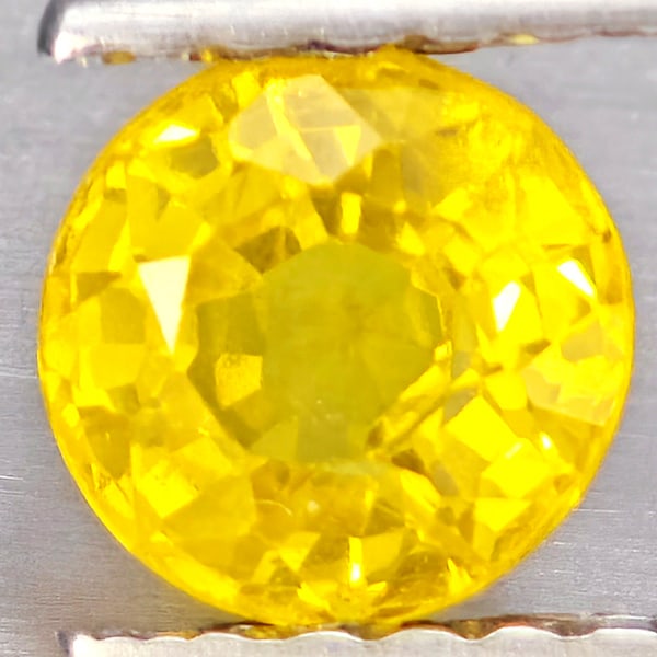 Natural Yellow Sapphire Gemstones 0.61 Ct. Round Shape 4.7 Mm.: Product ID: 806162943 Product Name: Natural Yellow Sapphire Weight: 0.61 CT. Size: 4.7 x 4.7 x 3.3 MM. Shape: Round Shape Color: Yellow Clarity:VSI Luster: Good Gems Origin: Thailand Treatment: Heated