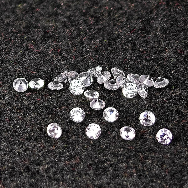 Natural White Zircon Gemstones 0.63 Ct. 30 Pcs Round Diamond Cut 1.5 Mm.: Product ID: 807743106 Product Name: Natural Zircon Weight: 0.63 CT. Size: 1.5 x 1.5 x 1.2 MM. Shape: Round Diamond Cut Color: White Clarity:VSI Luster: Good Gems Origin: Cambodia Treatment: Heated Cry
