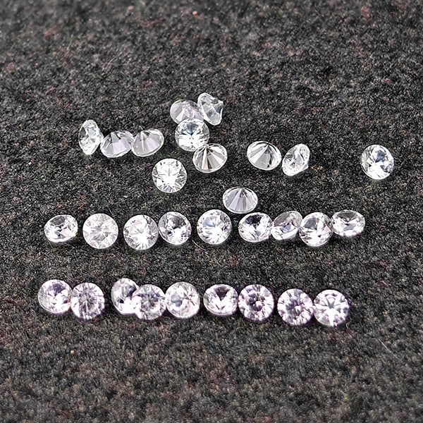 Natural White Zircon Gemstones 0.62 Ct. 30 Pcs Round Diamond Cut 1.5 Mm.: Product ID: 807743109 Product Name: Natural Zircon Weight: 0.62 CT. Size: 1.5 x 1.5 x 1.2 MM. Shape: Round Diamond Cut Color: White Clarity:VSI Luster: Good Gems Origin: Cambodia Treatment: Heated Cry