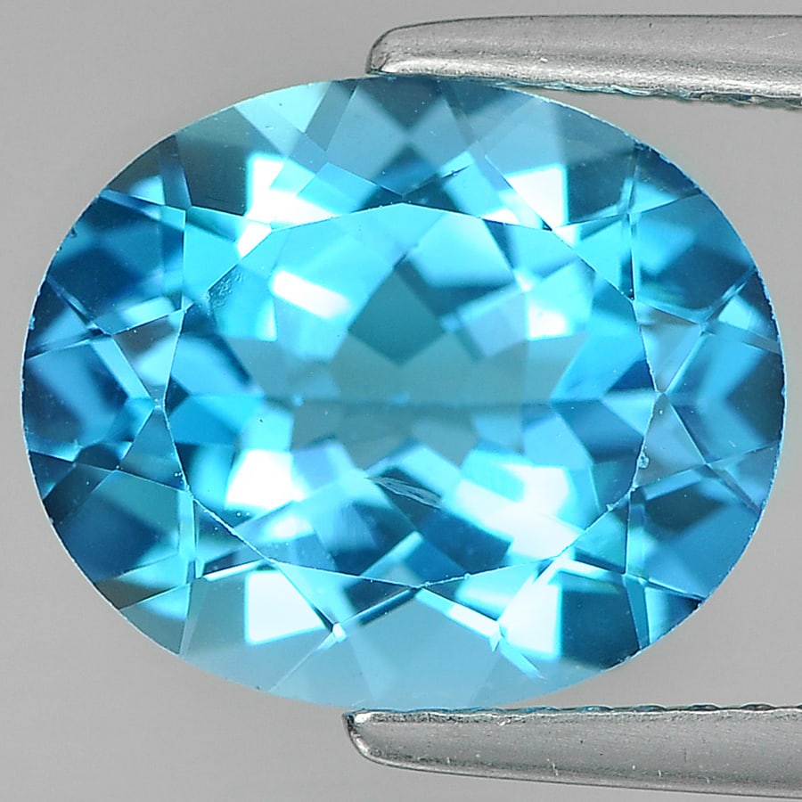 Natural Swiss Blue Topaz Gemstones 5.53 Ct. Clean Oval Shape 12 x 10 Mm.: Product ID: 807161171 Product Name: Natural Blue Topaz Weight: 5.53 CT. Size: 12 x 10 x 6.3 MM. Shape: Oval Color: Swiss Blue Clarity:VSI Luster: Good Gems Origin: Brazil Treatment: Treated Crystal St