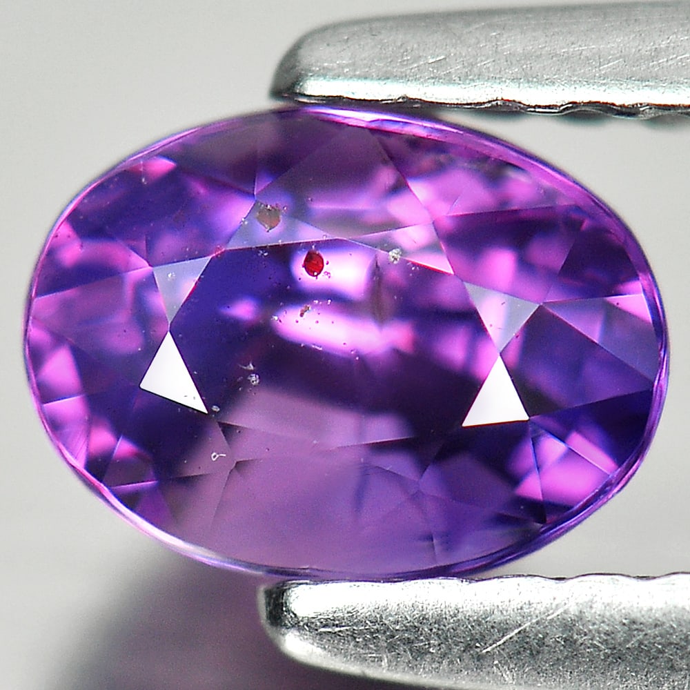 Natural Unheated Pinkish Purple Sapphire Gemstones 1.04 Ct. Oval Shape 6.4 x 4.8 Mm.: Product ID: 806140141 Product Name: Natural Purple Sapphire Weight: 1.04 CT. Size: 6.4 x 4.8 x 4.3 MM. Shape: Oval Color: Purple Clarity:VSI Luster: Very Good Gems Origin: Tanzania Treatment: Unheated
