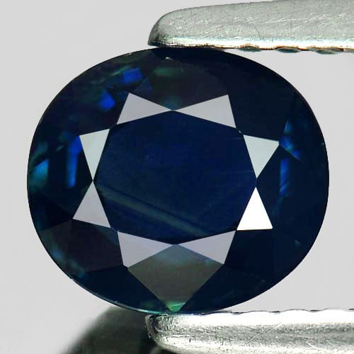 Natural Greenish Blue Sapphire Gemstones 1.19 Ct. Clean Oval Shape 6.8 x 6 Mm.: Product ID: 806008981 Product Name: Natural Blue Sapphire Weight: 1.19 CT. Size: 6.8 x 6 x 3 MM. Shape: Oval Color: Greenish Blue Clarity:VSI Luster: Good Gems Origin: Thailand Treatment: Heated Cryst