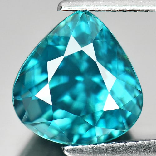 Natural Blue Zircon Gemstones 6.76 Ct. IF Pear Shape 10.4 x 10 Mm.: Product ID: 807720859 Product Name: Natural Zircon Weight: 6.76 CT. Size: 10.4 x 10 x 7.5 MM. Shape: Pear Color: Blue Clarity:IF Luster: Very Good Gems Origin: Cambodia Treatment: Heated Crystal Struc