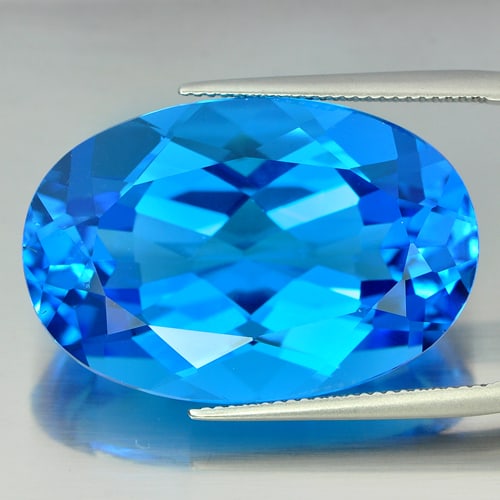 Natural Swiss Blue Topaz Gemstones 57.32 Ct. VVS Oval Shape 30 x 19.7 Mm.: Product ID: 807155600 Product Name: Natural Blue Topaz Weight: 57.32 CT. Size: 30 x 19.7 x 12.7 MM. Shape: Oval Color: Swiss Blue Clarity:VVS Luster: Very Good Gems Origin: Brazil Treatment: Treated C