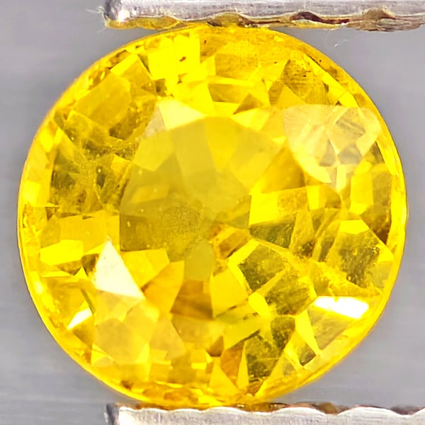 Natural Yellow Sapphire Gemstones 0.58 Ct. Round Shape 4.9 Mm.: Product ID: 806162938 Product Name: Natural Yellow Sapphire Weight: 0.58 CT. Size: 4.9 x 4.9 x 3 MM. Shape: Round Shape Color: Yellow Clarity:VSI Luster: Good Gems Origin: Thailand Treatment: Heated C