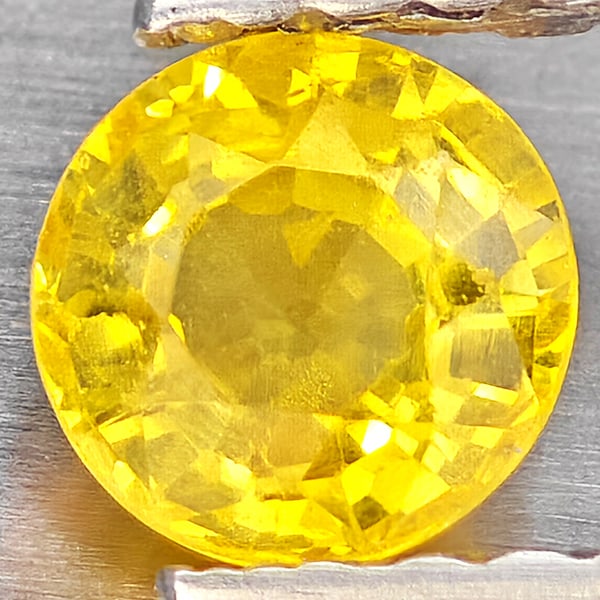 Natural Yellow Sapphire Gemstones 0.50 Ct. Round Shape 4.5 Mm.: Product ID: 806162954 Product Name: Natural Yellow Sapphire Weight: 0.50 CT. Size: 4.5 x 4.5 x 2.7 MM. Shape: Round Shape Color: Yellow Clarity:VSI Luster: Good Gems Origin: Thailand Treatment: Heated