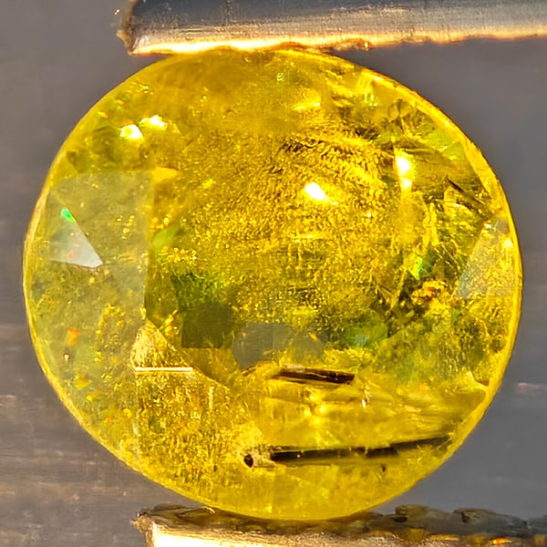 Natural Multi-Color With Rainbow Spark Sphene Gemstones 1.29 Ct. Oval Shape 6.6 x 6.4 Mm.: Product ID: 806509210 Product Name: Natural Sphene Weight: 1.29 CT. Size: 6.6 x 6.4 x 4.1 MM. Shape: Oval Shape Color: Multi-Color Clarity:SI1 Luster: Good Gems Origin: Madagascar Treatment: Unheated 