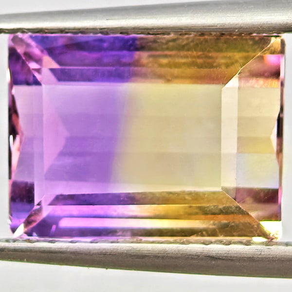 Natural Bi Color Ametrine Gemstones 5.27 Ct. Baguette Shape 11.6 x 8.6 Mm.: Product ID: 800408560 Product Name: Natural Ametrine Weight: 5.27 CT. Size: 11.6 x 8.6 x 6.2 MM. Shape: Baguette Color: Bi Color Clarity:VSI Luster: Good Gems Origin: Bolivia Treatment: Unheated Cryst