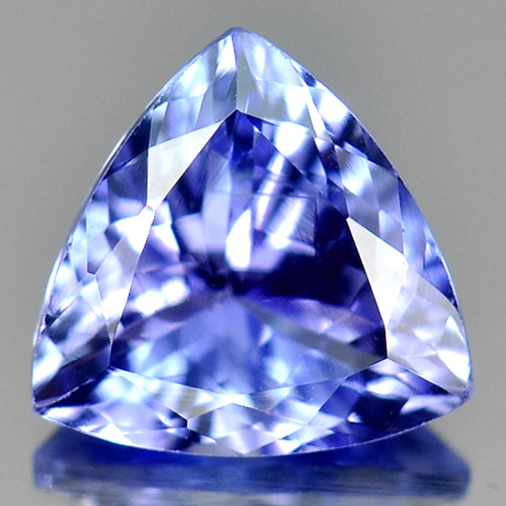 Natural Blue Tanzanite Gemstones 1.31 Ct. Trilliant Shape 7.6 x 7.5 Mm.: Product ID: 807009460 Product Name: Natural Tanzanite Weight: 1.31 CT. Size: 7.6 x 7.5 x 4 MM. Shape: Trilliant Color: Violetish Blue Clarity:VSI Luster: Very Good Gems Origin: Tanzania Treatment: Hea