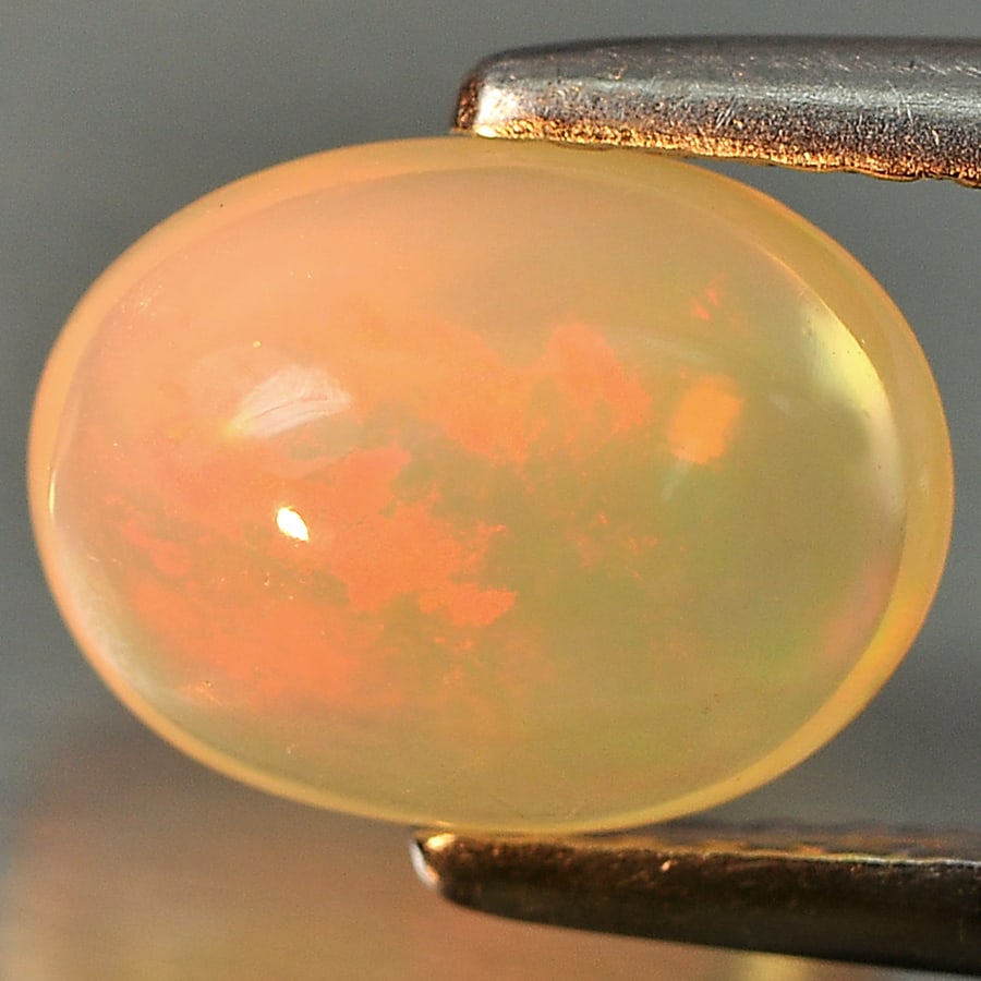 Natural Multi Color Opal Gemstones 1.36 Ct. Oval Cabochon Shape 8.9 x 6.7 Mm.: Product ID: 818715709 Product Name: Natural Opal Weight: 1.36 CT. Size: 8.9 x 6.7 x 4.6 MM. Shape: Oval Cabochon Color: Multi Color Clarity:Opaque Luster: Good Gems Origin: Ethiopia Treatment: Unheate