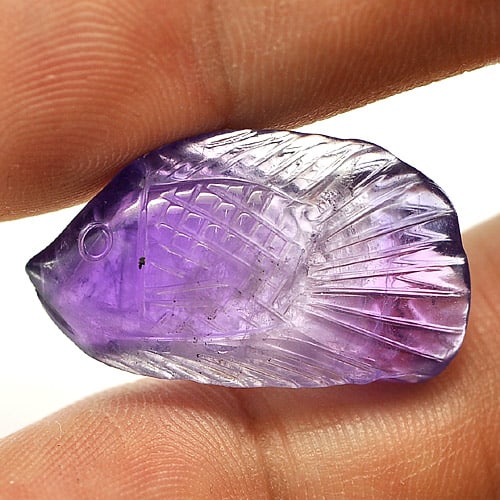 Natural Purple Amethyst Gemstones 14.77 Ct. Fish Carving 24 x 14 Mm.: Product ID: 810302846 Product Name: Natural Amethyst Weight: 14.77 CT. Size: 24 x 14 x 8 MM. Shape: Fish Carving Color: Purple Clarity:Semi - Transparent Luster: Good Gems Origin: Brazil Treatment: Un