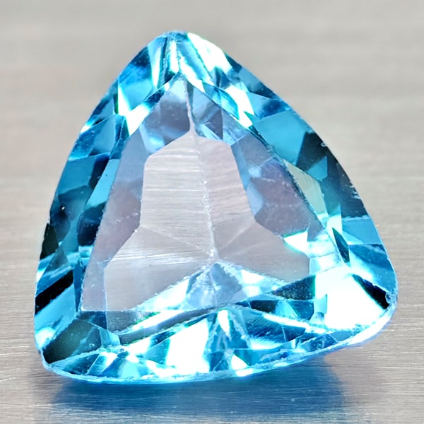 Natural Swiss Blue Topaz Gemstones 2.90 Ct. Clean Trilliant Shape 9.1 x 9.1 Mm.: Product ID: 807167957 Product Name: Natural Blue Topaz Weight: 2.90 CT. Size: 9.1 x 9.1 x 5.1 MM. Shape: Trilliant Color: Swiss Blue Clarity:VSI Luster: Good Gems Origin: Brazil Treatment: Treated Cry