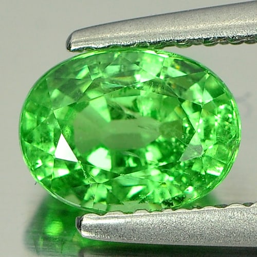 Natural Green Tsavorite Garnet Gemstones 1.32 Ct. Oval Shape 7.1 x 5.4 Mm.: Product ID: 803001473 Product Name: Natural Tsavorite Weight: 1.32 CT. Size: 7.1 x 5.4 x 4.1 MM. Shape: Oval Color: Green Clarity:VSI Luster: Very Good Gems Origin: Tanzania Treatment: Unheated Crysta