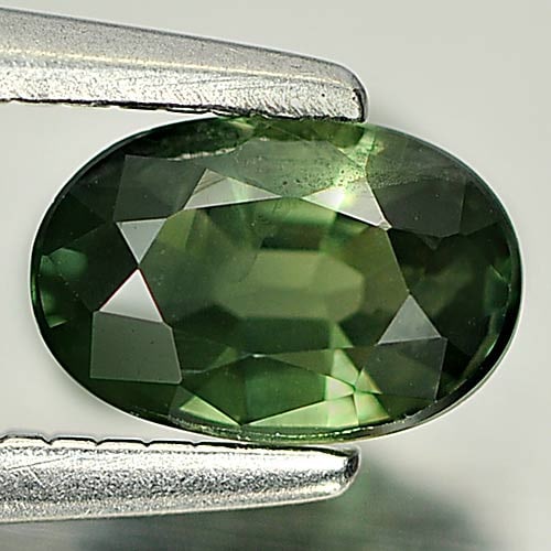 Natural Green Sapphire Gemstones 0.63 Ct. Oval Shape 6.1 x 4.1 Mm.: Product ID: 806157864 Product Name: Natural Green Sapphire Weight: 0.63 CT. Size: 6.1 x 4.1 x 2.8 MM. Shape: Oval Color: Green Clarity:VSI Luster: Good Gems Origin: Thailand Treatment: Heated Crystal 