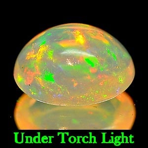 Natural Multi Color Play Of Colour Opal Gemstones 0.94 Ct. Oval Cabochon Shape 8 x 6.2 Mm.: Product ID: 818721907 Product Name: Natural Opal Weight: 0.94 CT. Size: 8 x 6.2 x 4.1 MM. Shape: Oval Cabochon Color: Multi Color Clarity:Semi - Transparent Luster: Strong Iridescent Gems Origin: Ethi