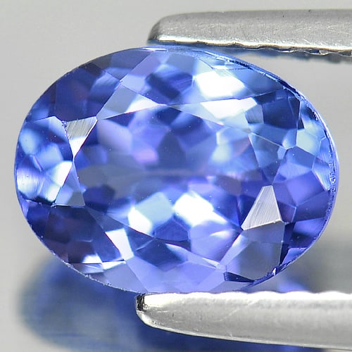 Natural Blue Tanzanite Gemstones 1.67 Ct. Oval Shape 8.3 x 6.4 Mm.: Product ID: 807009055 Product Name: Natural Tanzanite Weight: 1.67 CT. Size: 8.3 x 6.4 x 4.2 MM. Shape: Oval Color: Violetish Blue Clarity:VVS Luster: Good Gems Origin: Tanzania Treatment: Heated Crys