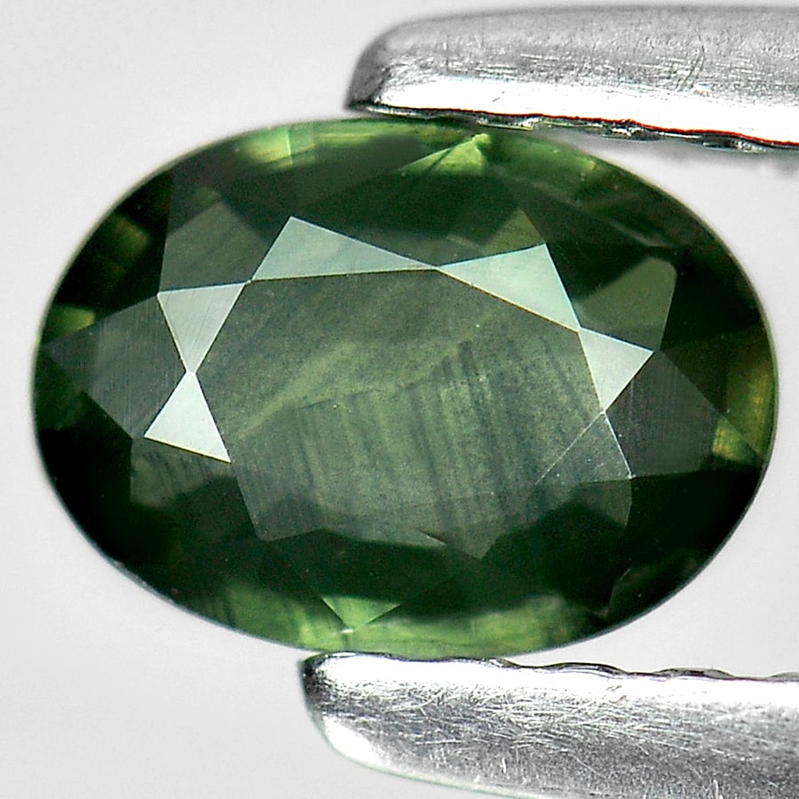 Natural Bluish Green Sapphire Gemstones 0.45 Ct. Oval Shape 5.9 x 4.3 Mm.: Product ID: 806154581 Product Name: Natural Green Sapphire Weight: 0.45 CT. Size: 5.9 x 4.3 x 2 MM. Shape: Oval Color: Bluish Green Clarity:VVS Luster: Good Gems Origin: Thailand Treatment: Heated Cry