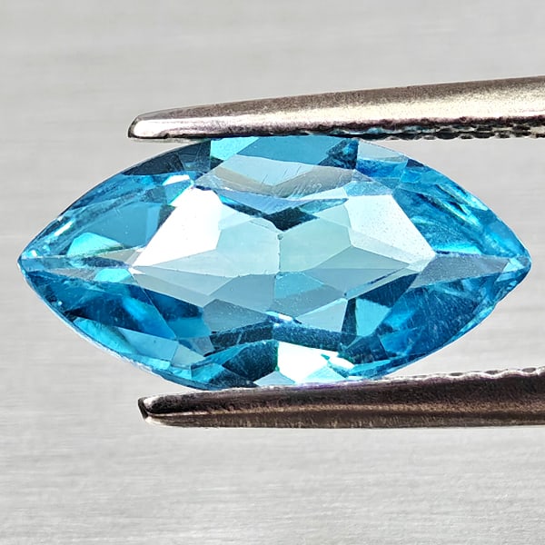 Natural Swiss Blue Topaz Gemstones 2.02 Ct. Marquise Shape 12 x 6.2 Mm.: Product ID: 807168208 Product Name: Natural Blue Topaz Weight: 2.02 CT. Size: 12 x 6.2 x 4.1 MM. Shape: Marquise Shape Color: Swiss Blue Clarity:VSI Luster: Good Gems Origin: Brazil Treatment: Treated