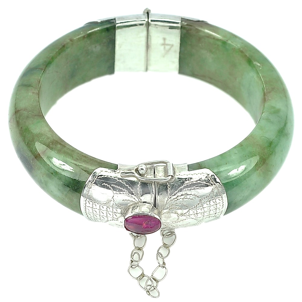 Natural Green Jade Bangle 403.22 Ct. Silver Jewelry with Red Ruby Gemstones: Product ID: 819812603 Product Name: Natural Jade Weight: 403.22 CT. Size: 70 x 56 x 18 MM. Shape: Round Cabochon Color: Green Clarity:Opaque Luster: Good Gems Origin: Thailand Treatment: Unheated Crys