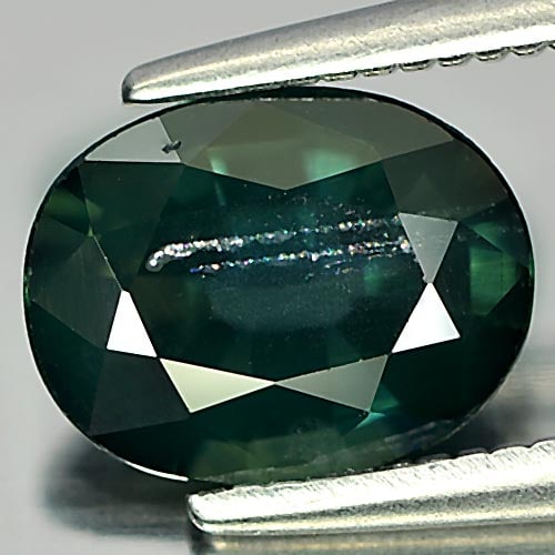 Natural Green Sapphire Gemstones 1.52 Ct. Oval Shape 8.2 x 6.4 Mm.: Product ID: 806142729 Product Name: Natural Green Sapphire Weight: 1.52 CT. Size: 8.2 x 6.4 x 3.6 MM. Shape: Oval Color: Green Clarity:SI Luster: Good Gems Origin: Thailand Treatment: Heated Crystal S