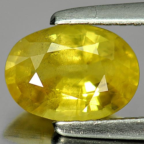 Natural Yellow Sapphire Gemstones 1.38 Ct. Oval Shape 7.9 x 5.8 Mm.: Product ID: 806153988 Product Name: Natural Yellow Sapphire Weight: 1.38 CT. Size: 7.9 x 5.8 x 3.6 MM. Shape: Oval Color: Yellow Clarity:VSI Luster: Good Gems Origin: Thailand Treatment: Heated Crysta