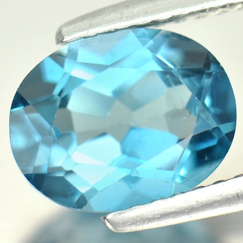 Natural London Blue Topaz Gemstones 2.40 Ct. Clean Oval Shape 9 x 7 Mm.: Product ID: 807161743 Product Name: Natural Blue Topaz Weight: 2.40 CT. Size: 9 x 7 x 4.8 MM. Shape: Oval Color: London Blue Clarity:VSI Luster: Good Gems Origin: Brazil Treatment: Treated Crystal Str