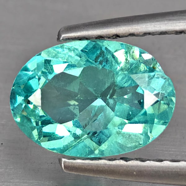 Natural Paraiba Color Apatite 1.67 Ct. Oval Shape 8.9 x 6.3 Mm.: Product ID: 100600299 Product Name: Natural Apatite Weight: 1.67 CT. Size: 8.9 x 6.3 x 4.4 MM. Shape: Oval Color: Neon Blue Clarity:SI Luster: Good Gems Origin: Tanzania Treatment: Unheated Crystal St
