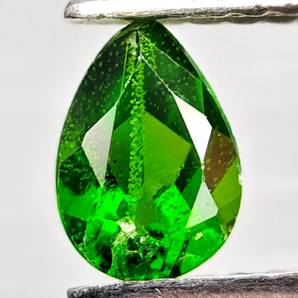 Natural Green Chrome Diopside Gemstones 0.51 Ct. Pear Shape 6.1 x 4.2 Mm.: Product ID: 801608207 Product Name: Natural Chrome Diopside Weight: 0.51 CT. Size: 6.1 x 4.2 x 3 MM. Shape: Pear Shape Color: Green Clarity:VSI - SI1 Luster: Good Gems Origin: Russia Treatment: Unheat